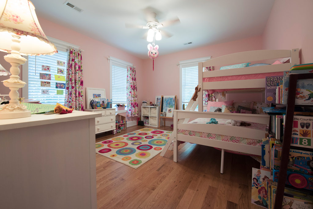 Ample room, hardwood floors and ceiling fan make for a comfortable space.