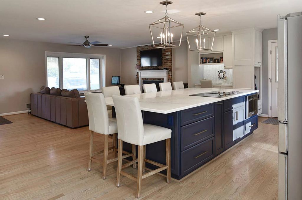 Granite top island with glass cooktop and drawer style microwave. This space is now connected to the living room.