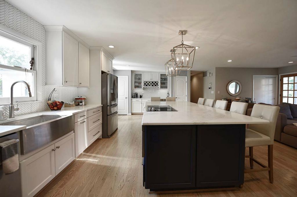 Country sink and herringbone backsplash. The 'wood' floor is durable, luxury tile.