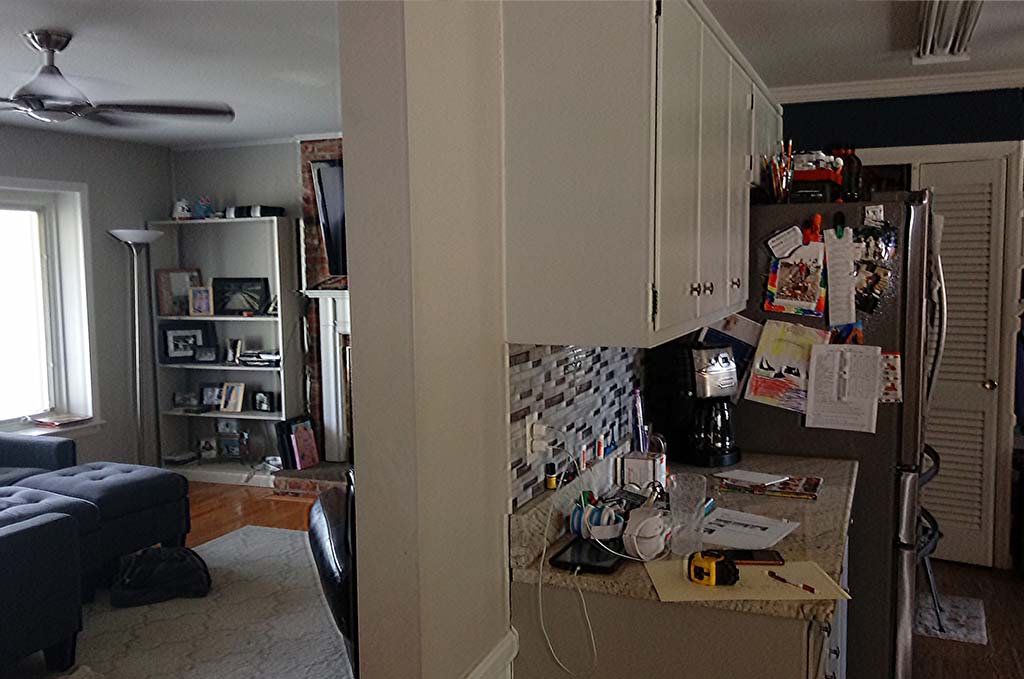 A view of the separate living room and kitchen area before remodel.