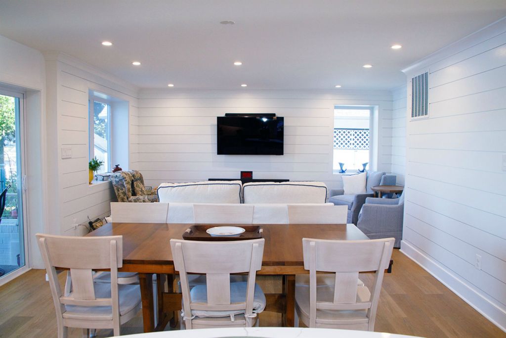 Family room now presents a clean, modern space with plenty of natural light.